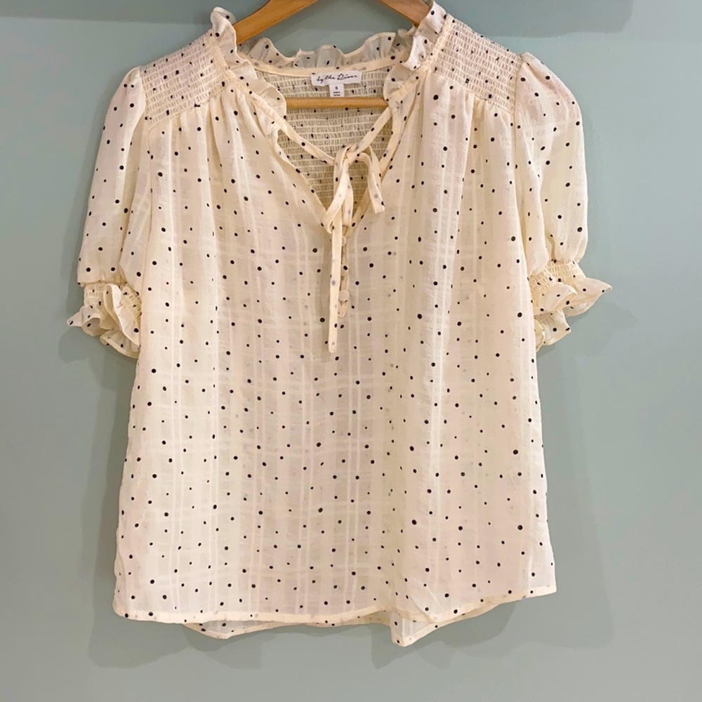 Polka dot blouse in a size small.